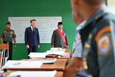 France's President Emmanuel Macron (2nd left) and President Prabowo Subianto (3rd left) visit the Military Academy in Magelang, Central Java on May 29, 2025. 