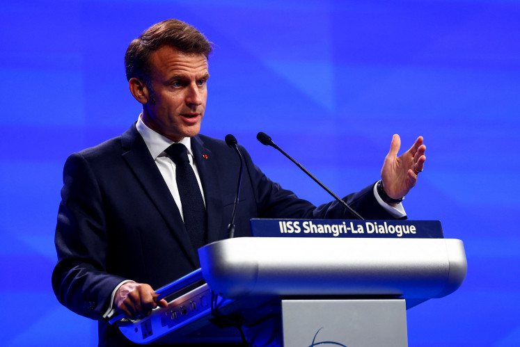 French President Emmanuel Macron delivers the keynote address at the IISS Shangri-La Dialogue security summit in Singapore, May 30, 2025.