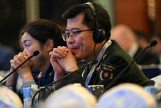 Chinese military officials attend the Shangri-La Dialogue Summit in Singapore on May 31, 2025. 