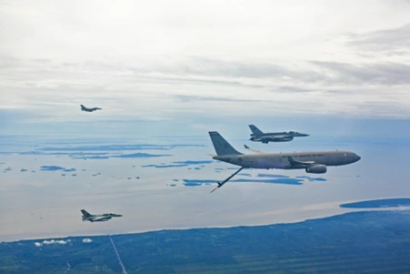 An Airbus A330 Multi Role Tanker and Transport (MRTT) operated by the 112th squadron of the Republic of Singapore Air Force (right) prepares to refuel two Indonesian Air Force F-16 fighter jets (left) on May 16, 2025, the third day of the 10-day Elang Indopura joint exercise at the Roesmin Noerjadin Air Force Base in Pekanbaru, Riau.