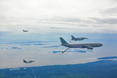 An Airbus A330 Multi Role Tanker and Transport (MRTT) operated by the 112th squadron of the Republic of Singapore Air Force (right) prepares to refuel two Indonesian Air Force F-16 fighter jets (left) on May 16, 2025, the third day of the 10-day Elang Indopura joint exercise at the Roesmin Noerjadin Air Force Base in Pekanbaru, Riau.