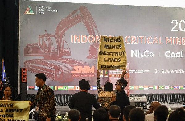 Critical voice: Greenpeace Indonesia activists unfurl banners on June 3, 2025, to protest nickel mining in Raja Ampat, Southwest Papua, during the Indonesia Critical Minerals Conference & Expo 2025 in Jakarta. 