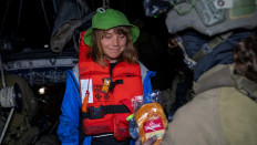 An Israeli solider passes a bun to Greta Thunberg onboard the Gaza-bound British-flagged yacht “Madleen“ after Israeli forces boarded the charity vessel as it attempted to reach the Gaza Strip in defiance of an Israeli naval blockade, in this still image released on June 9, 2025. 