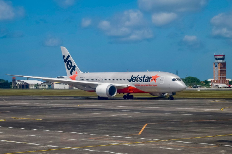A Jetstar passenger plane prepares for take-off at the I Gusti Ngurah Rai International Airport in Denpasar, Bali on May 13, 2023. 