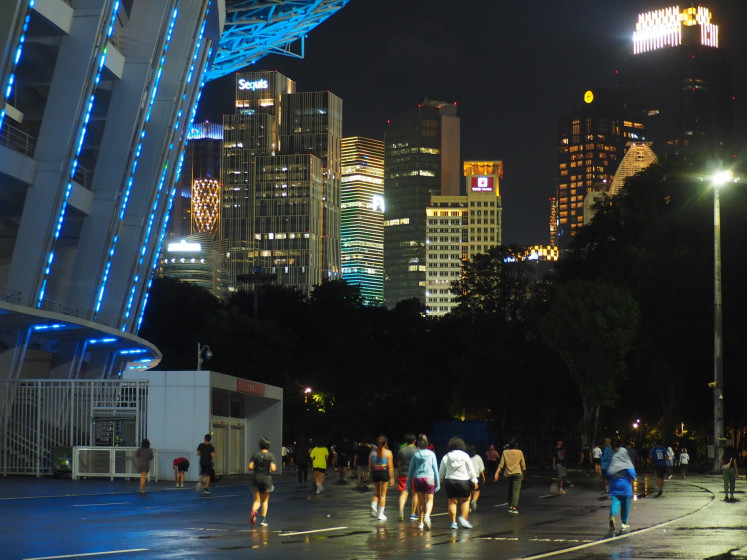 Letting off steam: People jog on April 2, 2024, around the Gelora Bung Karno (GBK) main stadium in Central Jakarta.