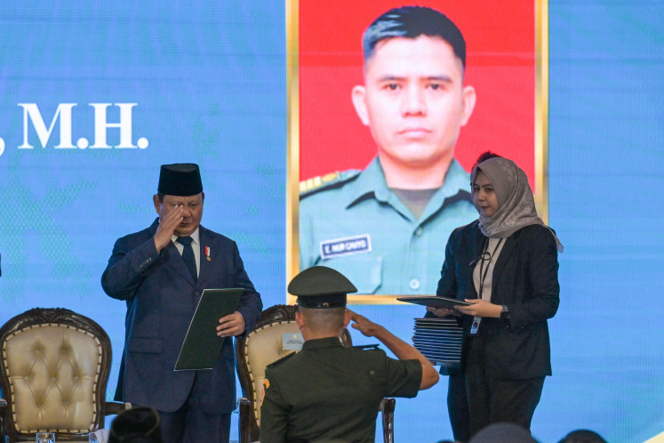 President Prabowo Subianto (left) inaugurates a representative of the prospective military judges at the Supreme Court building in Central Jakarta, on June 12, 2025. The Supreme Court inaugurated 1,451 judges from the General Courts, Religious Courts, Military Courts and Administrative Courts, marking the first such appointment since the last career judge induction in 2020. 