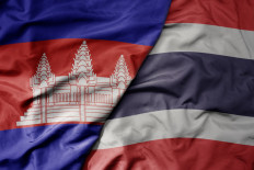 Illustration of Cambodian (left) and Thailand flags.