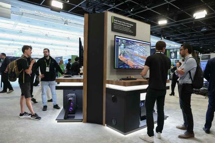 Attendees tour stands at the GTC Paris NVIDIA, at the VivaTech technology startups and innovation fair at the Paris Expo Porte de Versailles, in Paris on June 12, 2025.