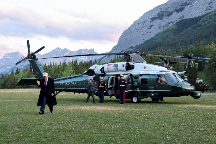 United States President Donald Trump arrives to attend the G7 Leaders' Summit at the Rocky Mountain resort town of Kananaskis, Alberta, Canada, June 15, 2025.