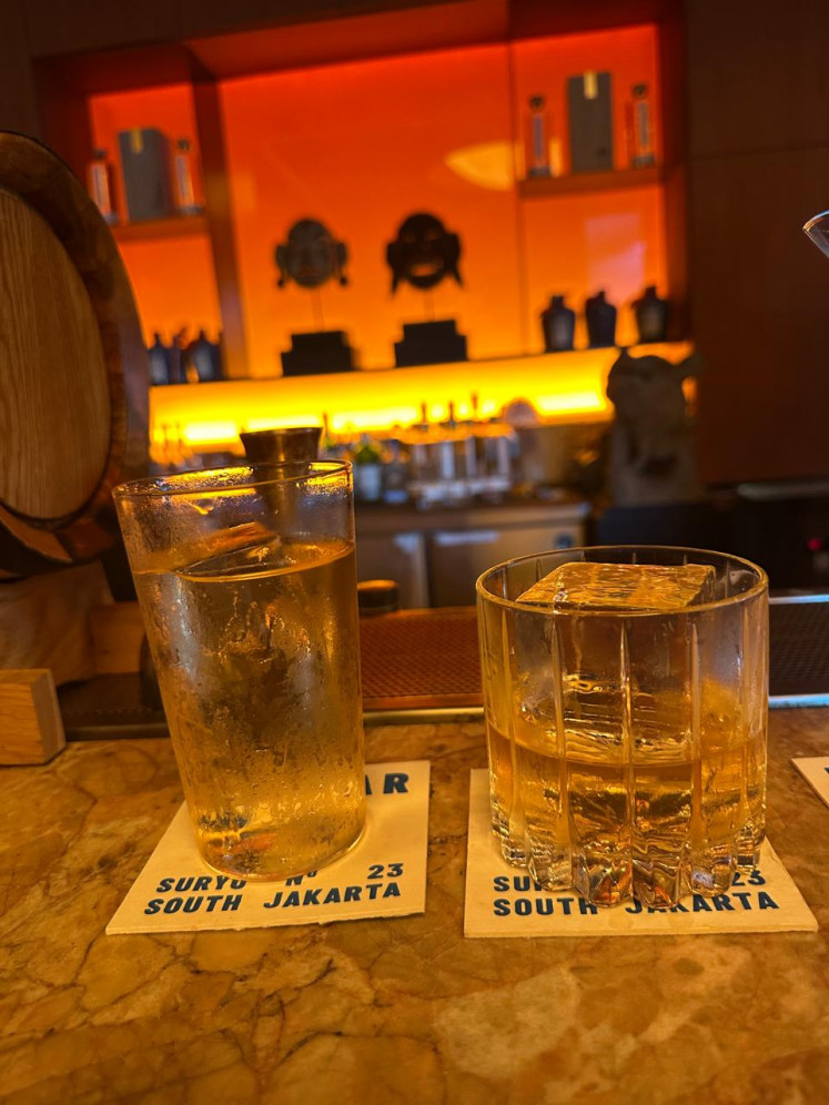Two takes on arak, crisp in a highball to the left and strong on the rocks to the right.