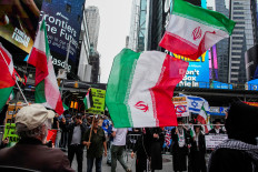 People take part in a protest in support of Iran and Palestinians, at Times Square in New York City, US, June 16, 2025. 