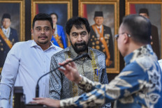 North Sumatra Governor Bobby Nasution (left) and Aceh Governor Muzakir Manaf attend the Presidential Office in Jakarta for a video conference meeting with President Prabowo Subianto on June 17, 2025. The meeting decided that four disputed islands along the border between the two provinces now belong to Aceh.