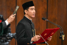 Vice-President Gibran Rakabuming Raka takes the oath during the presidential inauguration ceremony at the Parliament building in Jakarta on Oct. 20, 2024. 