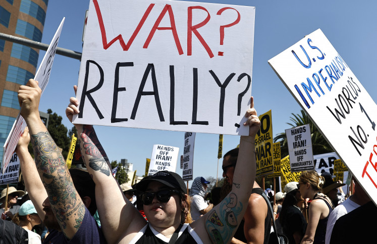 Demonstrators gather outside the Wilshire Federal Building during a rally opposing the United States' strikes on Iran on June 22, 2025 in Los Angeles, California. The U.S. overnight dropped a series of bombs on several alleged nuclear facilities in Iran, joining Israel's ongoing strikes within the country. Iran responded with a barrage of missiles at Israel and promised retaliation against U.S. interests in the region.  