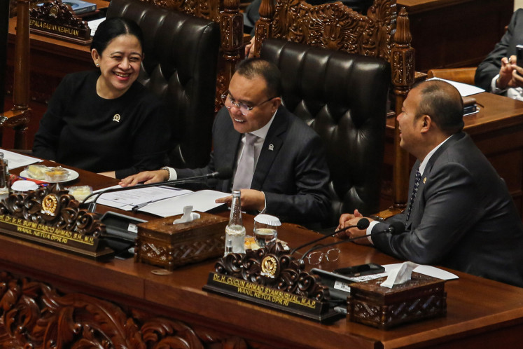 House of Representatives Speaker Puan Maharani (left) speaks with deputy speakers Sufmi Dasco Ahmad (center) and Cucun Ahmad Syamsurijal during a plenary session at the House in Jakarta, on June 24, 2025. 