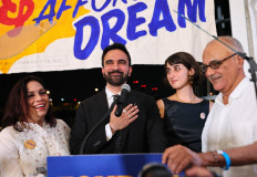 New York mayoral candidate, State Rep. Zohran Mamdani (D-NY) (second from left) and his wife Rama Duwaji (third from left) celebrate on stage with his parents renowned filmmaker Mira Nair (left) and academician Mahmood Mamdani (right) during an election night gathering at The Greats of Craft LIC on June 24, 2025 in the Long Island City neighborhood of the Queens borough in New York City, US. Mamdani was announced as the winner of the Democratic nomination for mayor in a crowded field in the City's mayoral primary to choose a successor to Mayor Eric Adams, who is running for re-election on an independent ticket.  
