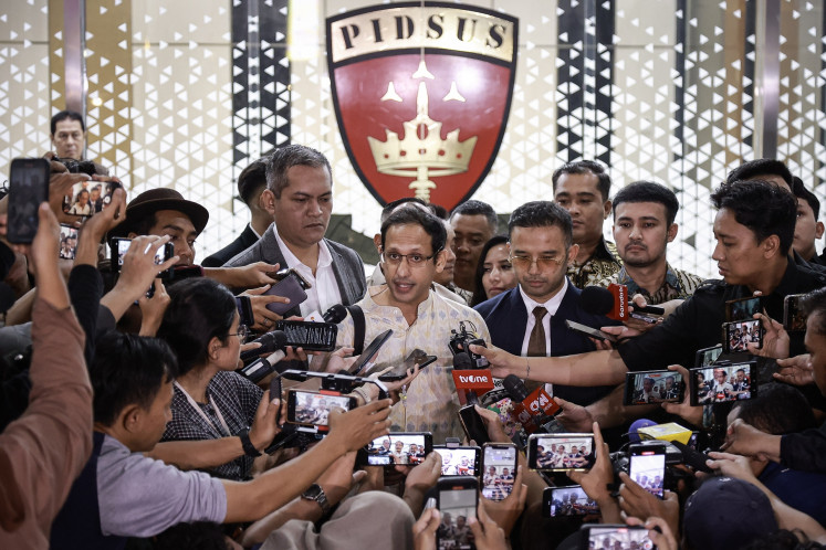 Nadiem Makarim (center) speaks to reporters at the Attorney General's Office in South Jakarta on June 23, 2025, after his interrogation as a witness in the 2019-2022 Chromebook graft case during his tenure as education minister.