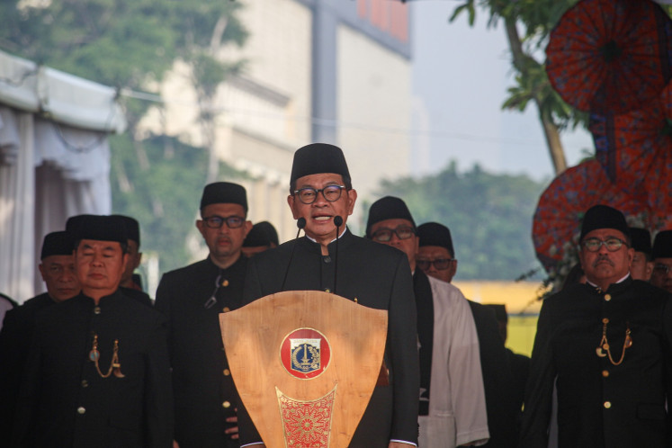 Celebrating the city: Jakarta Governor Pramono Anung delivers a speech during a flag ceremony on June 22 to commemorate the 498th anniversary of Jakarta at the National Monument (Monas) Square in Central Jakarta.