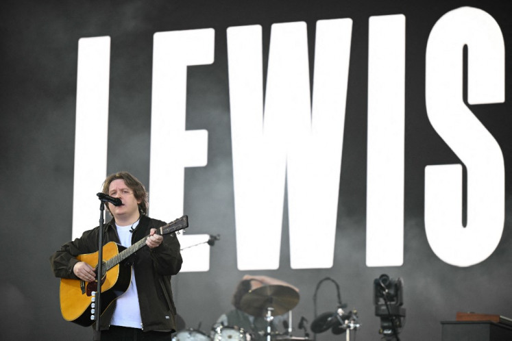 Scottish singer Lewis Capaldi performs on the pyramid stage during the third day of the Glastonbury festival at Worthy Farm in the village of Pilton in Somerset, southwest England, on June 27, 2025.