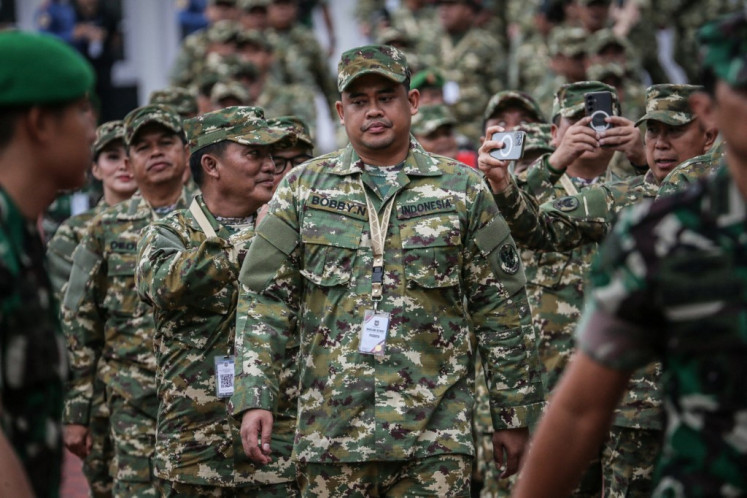 Military way: North Sumatra Governor Bobby Nasution (center), also son-in-law of former president Joko “Jokowi“ Widodo, walks on Feb. 21 as regional heads begin a weeklong retreat at the Military Academy (Akmil) in Magelang, Central Java.