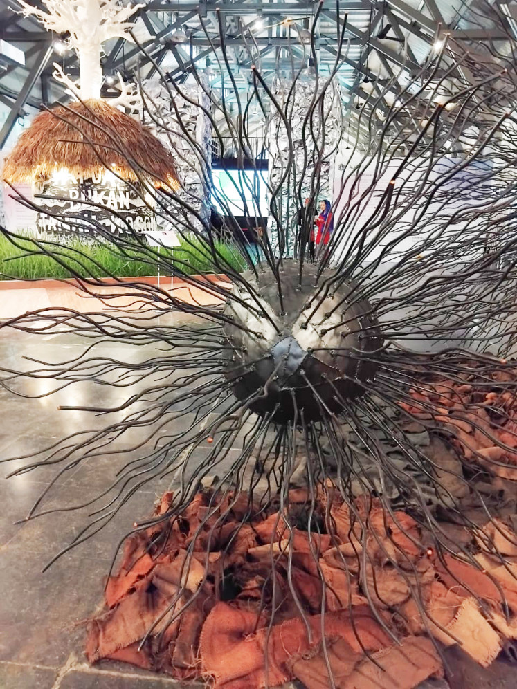 'Abhipraya Nawasena', a 3-meter-high sculpture by Yani Mariani Sastranegara featuring stones made of recycled resin drums.