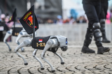 A K9 robot takes part in a parade during the 79th anniversary of the National Police, also known as Bhayangkara Day, at the National Monument (Monas) in Central Jakarta, on Tuesday. This year’s celebration carries the theme “Police for the People”, reflecting the spirit of service and transformation within the National Police.