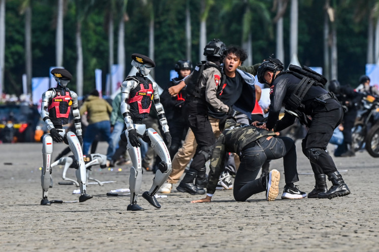 Showcasing technology: Police robots perform during the National Police's 79th anniversary on July 1 at the National Monument (Monas) complex in Jakarta. 