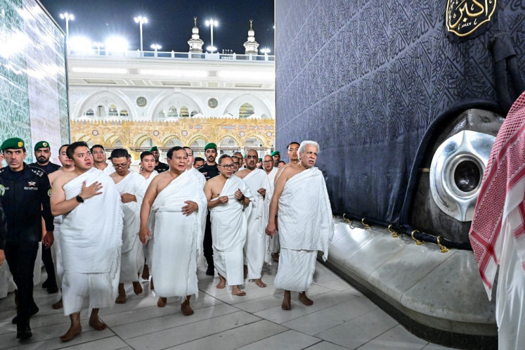 This handout photo taken on July 2, 2025 and released on July 3, 2025 by the Presidential Palace shows President Prabowo Subianto (center) performing the umrah pilgrimage in Mecca during his three-day visit to Saudi Arabia. 