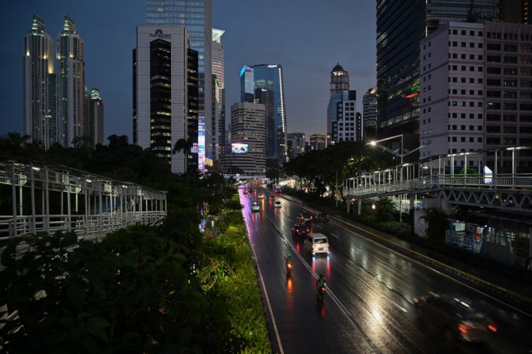 Few vehicles are seen on the usually busy Jl. Sudirman in Central Jakarta on March 31, 2020, as the government called on people to stay home amid COVID-19.