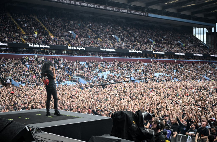 Member of US rock band Anthrax, Joey Belladonna performs for the crowd as a support act, during British rock band Black Sabbath's “Back to The Beginning“ concert, Ozzy Osbourne's final ever gig as Black Sabbath's frontman at Villa Park in Birmingham, central England on July 5, 2025. 