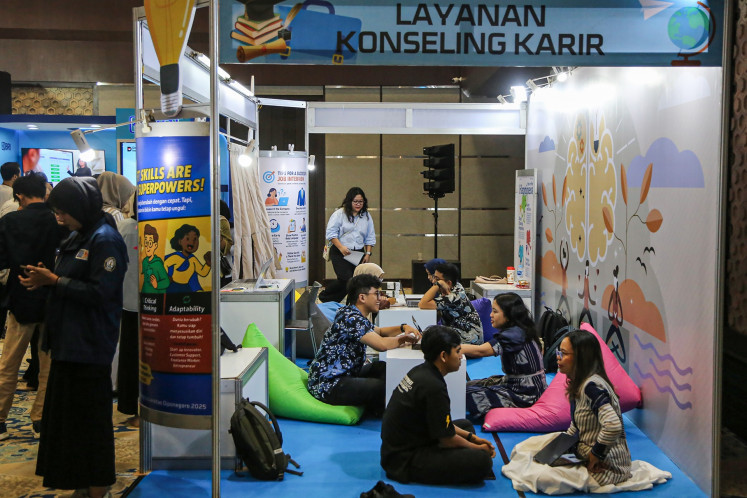 Job seekers speak with career counselors on June 24, 2025, during the Grand Career Exhibition held by Diponegoro University in Semarang, Central Java.