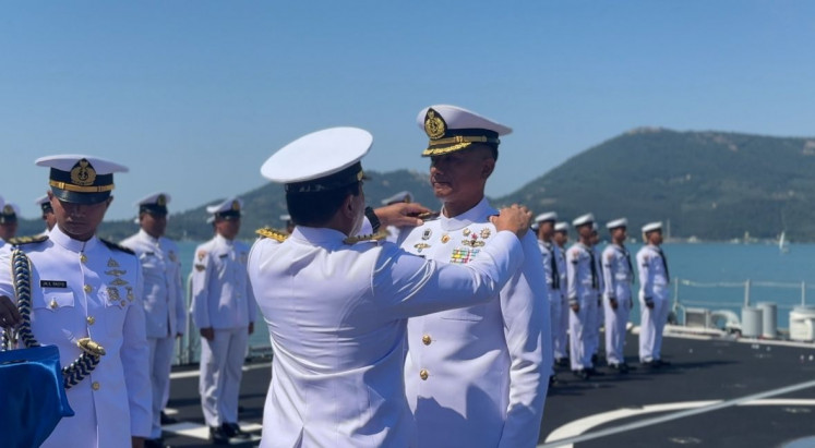 Indonesian Navy chief of staff Adm. Muhammad Ali (center) attaches commanding officer shoulder strap on Col. John David Nalasakti Sondakh during a ceremony onboard the KRI Brawijaya in Muggiano, Italy, on Wednesday, July 2. Ali officiated John as the first commanding officer of the brand new Italian-made frigate.