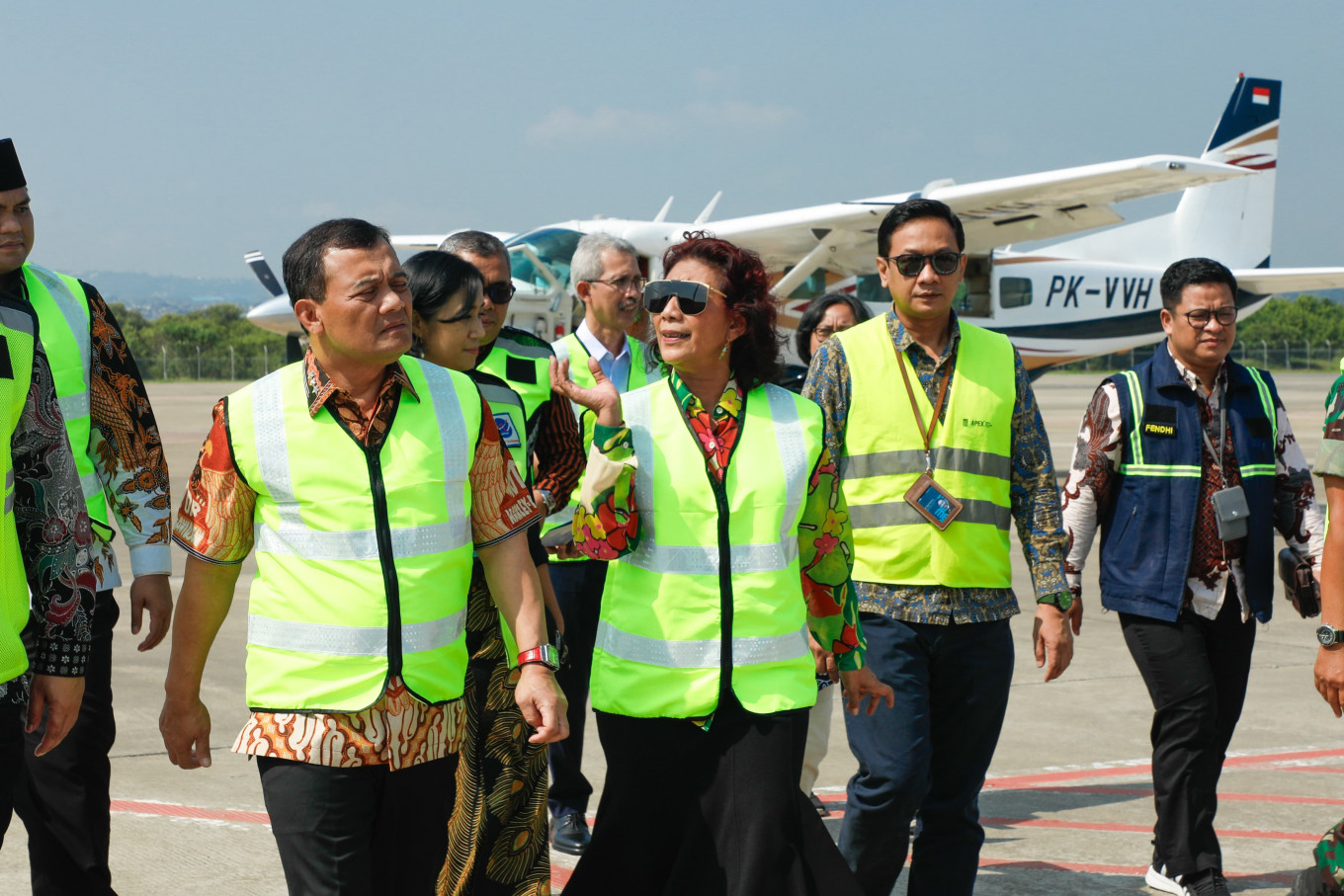 Susi Air owner Susi Pudjiastuti (center) talks to Central Java Governor Ahmad Luthfi (left) at Ahmad Yani International Airport in Semarang on Friday, July 4. The airline started a route linking Semarang with Karimunjawa in Jepara regency, Central Java.