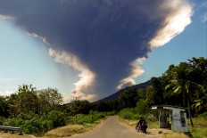 Mount Lewotobi Laki-laki erupts, as seen from Nangahale village in Sikka, East Nusa Tenggara on July 7, 2025. 