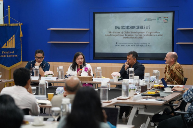The Foreign Ministry’s director of international cooperation, Rina Setyawati (second left), speaks during a discussion on July 3, 2025, at the Indonesian International Islamic University’s (UIII) campus in Depok, West Java. Rina was joined by Philips J. Vermonte, the university’s dean of the Faculty of Social Sciences, Anshory Yusuf (second right) of Padjadjaran University’s SDG Center and Andy Sumner (right) of King’s College London. The discussion was hosted by UIII and the newly launched Indonesian Institute for Foreign Affairs (IIFA).