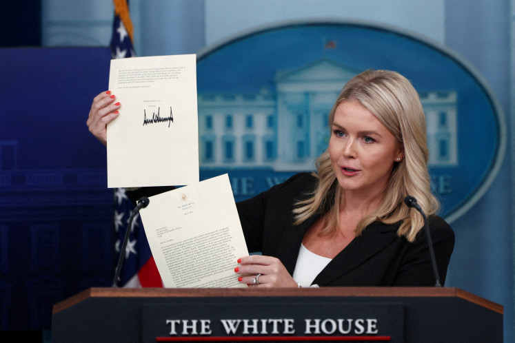 White House Press Secretary Karoline Leavitt shows a signed letter on tariffs to South Korean President Lee Jae-myung on July 7, 2025, at the White House in Washington, DC. United States President Donald Trump sent a similar letter to President Prabowo Subianto, warning that Washington will impose a 32 percent tariff unless Jakarta works out a trade and investment deal.