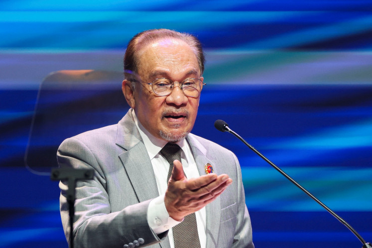 Malaysian Prime Minister Anwar Ibrahim delivers his speech during the 58th Association of Southeast Asian Nations Foreign Ministers' Meeting at Kuala Lumpur, Malaysia, July 9, 2025. 