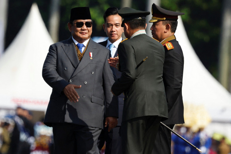 President Prabowo Subianto and Vice President Gibran Rakabuming Raka attend a ceremony to mark the 79th anniversary of National Police at the National Monument (Monas) in Jakarta, on July 1. 