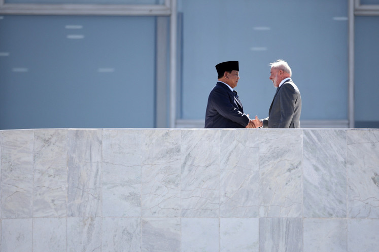 Brazilian President Luiz Inacio Lula da Silva (right) shakes hands with President Prabowo Subianto at Planalto Presidential Palace in Brasilia, Brazil on July 9, 2025.