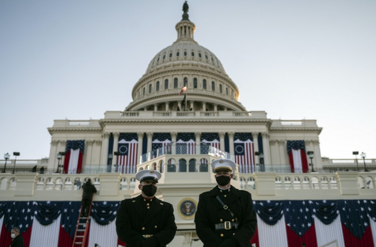 Two US Marines take up positions on the West Front of the US Capitol as preparations are made prior to the 59th inaugural ceremony for President-elect Joe Biden and Vice President-elect Kamala Harris in Washington, DC on Jan. 20. 