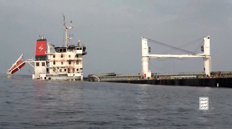 A vessel said to be Greek-operated, Liberia-flagged Eternity C sinks in a footage released by Yemen's Houthis in the Red Sea in this screen grab taken from a handout video released on July 9, 2025. 