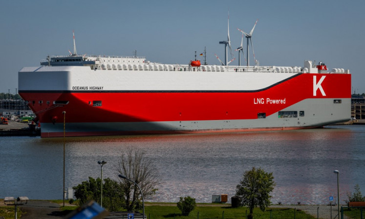 The car carrier ship Oceanus Highway is moored at the harbor of Bremerhaven, northern Germany, on June 12, 2025. Bremerhaven is the biggest German port for the automotive industry and the second-largest container port of Germany and thus a hub for a wide range of im- and export products.