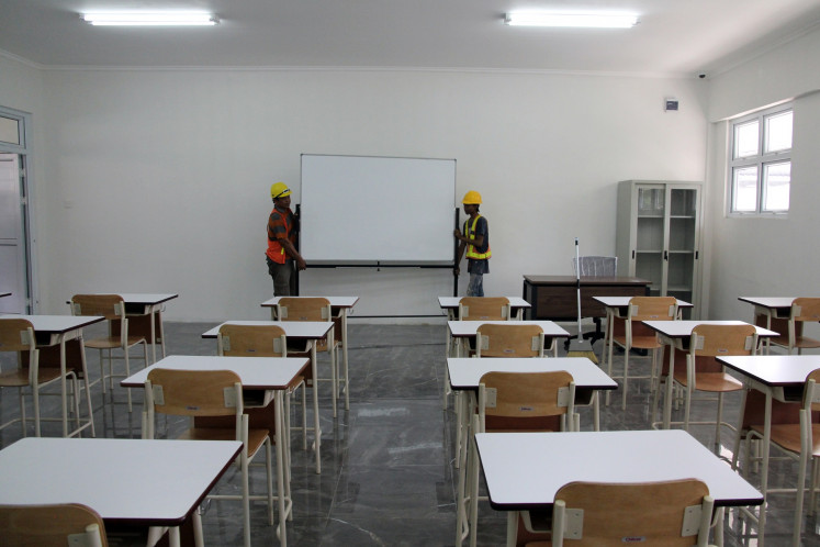 Blank slate: Workers set a whiteboard in a classroom on Friday at a Sekolah Rakyat (community school) site in Medan, North Sumatra. The Social Affairs Ministry, which spearheads President Prabowo Subianto's flagship education program, will launch Sekolah Rakyat on Monday with 63 sites accommodating more than 6,000 students nationwide.