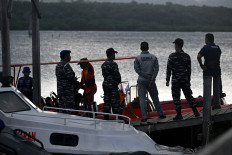 Rescuers search for missing victims of a ferry accident in the waters off the Bali Strait near Jembrana, Bali Island, on July 5. Hundreds of Indonesian rescuers widened their search for dozens of missing people on July 4, after a ferry sank in rough seas on the way to the resort island of Bali, with six bodies recovered.