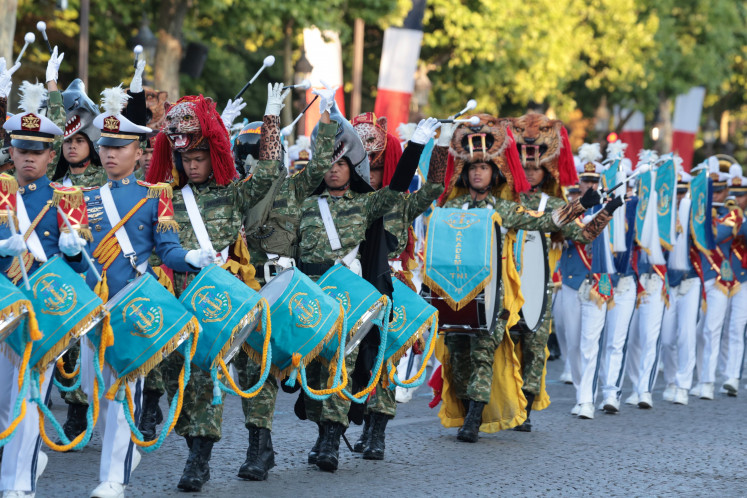 The joint Indonesian Military (TNI) Academy drum band performs during the full-dress general rehearsal for Bastille Day Parade in Paris on Saturday, July 12. The drum band, consisting of cadets from the academies of the three services as well as the Police Academy, is part of the Patriot II Task Force representing Indonesia as the guest of honor at the French National Day parade.