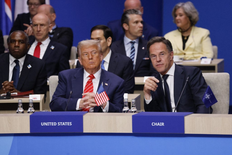 Britain's Foreign Secretary David Lammy, US President Donald Trump and NATO Secretary General Mark Rutte (from left to right) attend the start of a NATO leaders summit in The Hague, Netherlands June 25, 2025.