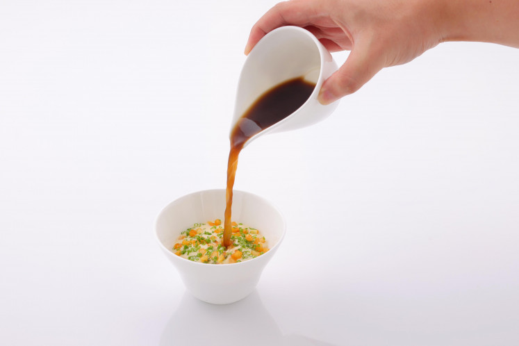 Leek and potato soup with charred leek broth—meant to be sipped, topped with crispy bits for an extra crunch.