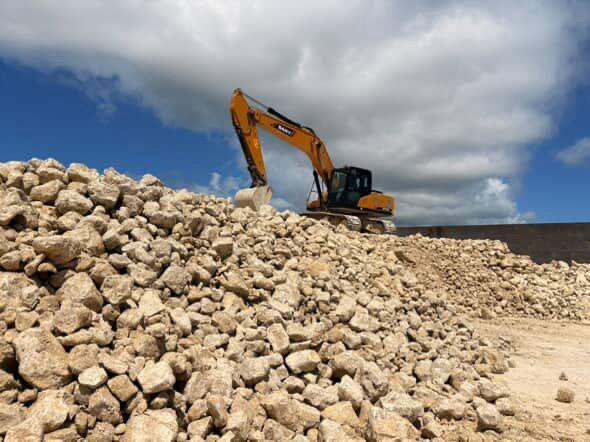 An excavator operates at a limestone quarry in the Kei Islands, an archipelago of small islands in Southeast Maluku, Maluku province, in this undated photo.