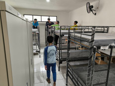 Students of the SRMP 9 Sekolah Rakyat junior high school at the Wyata Guna center in Bandung, West Java try out their bunk beds on July 14 after attending the opening of an orientation program.