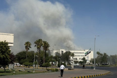 Smoke billows from an area near the Syrian army’s headquarters and the defense ministry in Damascus on July 16, 2025, following Israeli strikes.